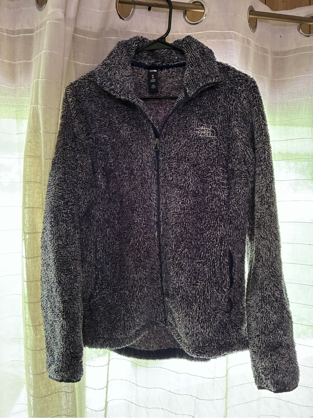 The North Face Women’s Med. Jean/Navy colored Teddy zip-up jacket